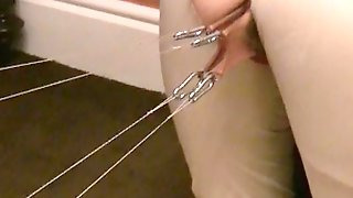 The pussy lip stretch machine in action